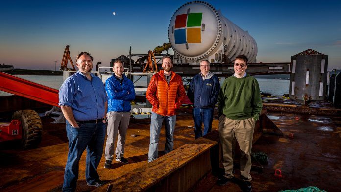 Microsoft's Project Natick team photographed at the launch site in the city of Stromness on Orkney Island, Scotland